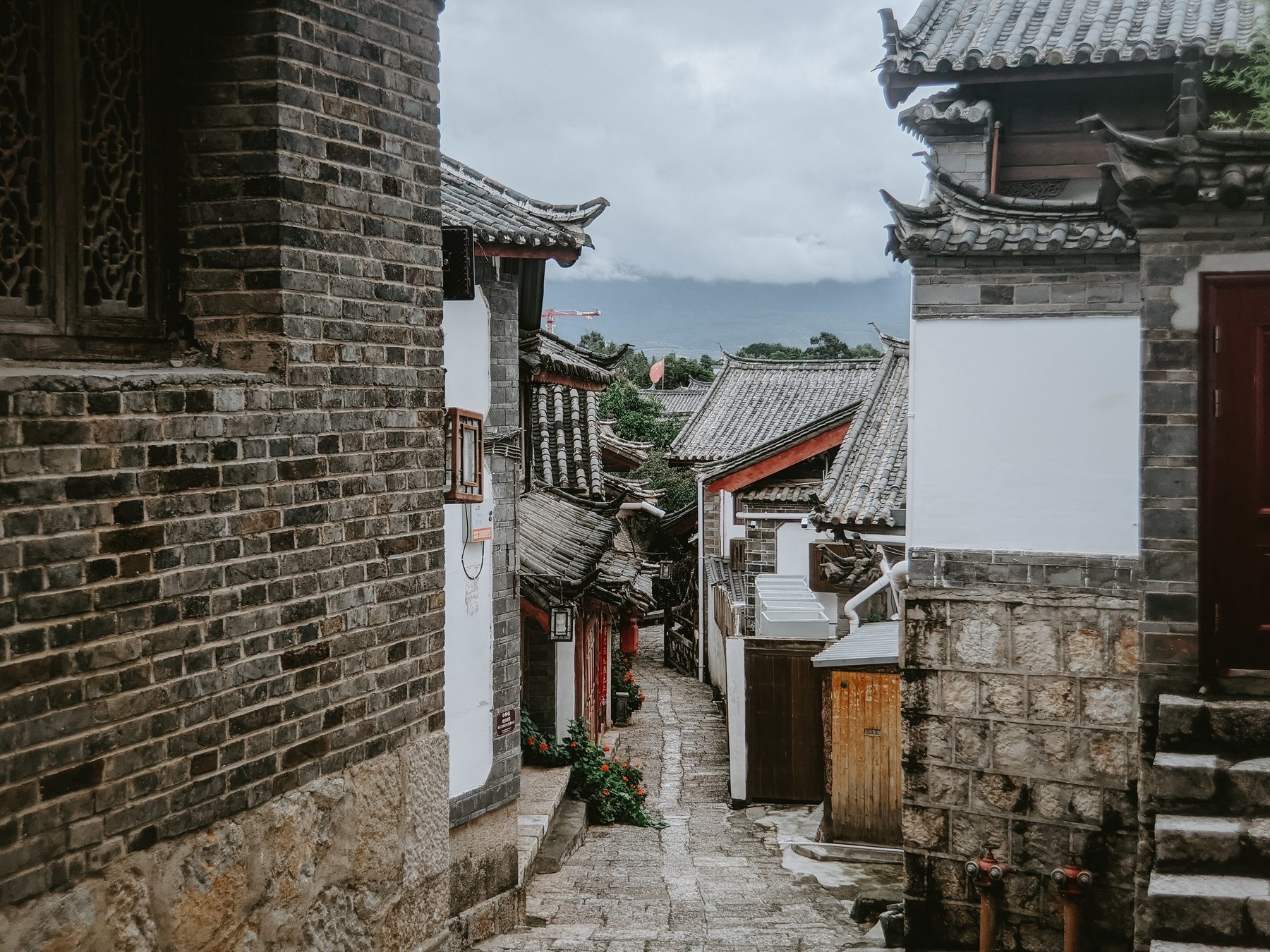 A quiet lane of tiled hanok roofs in Bukchon Hanok Village, Seoul.